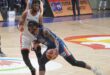 Akil Mitchell of Meralco (with ball) drives hard against the defense of NorthPort&rsquo;s Kadeem Jack.